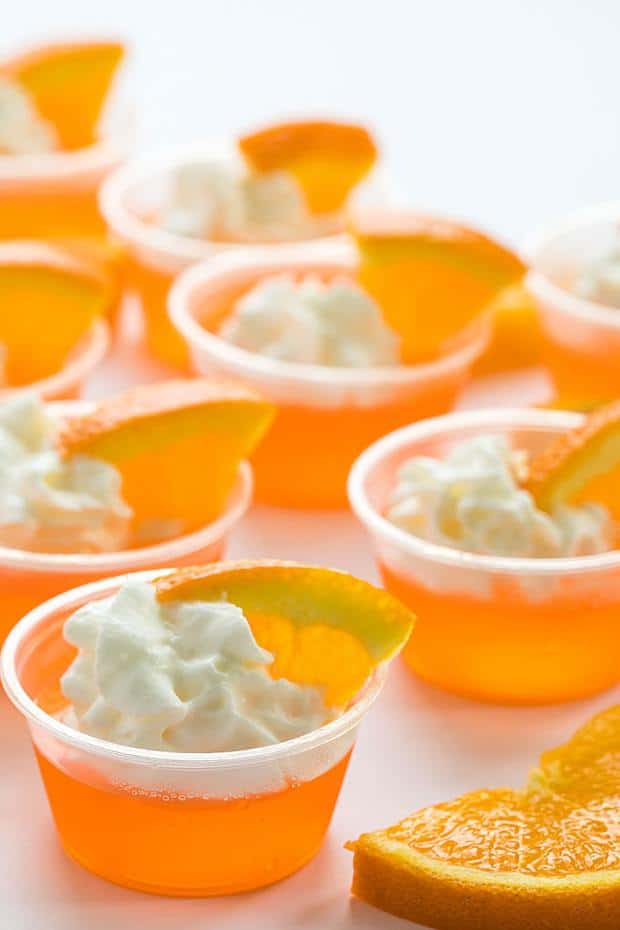 These little jello shots are so easy to whip up and are always welcomed at adult gatherings.  Top them off with whipped cream and a tiny orange slice to make them even tastier.