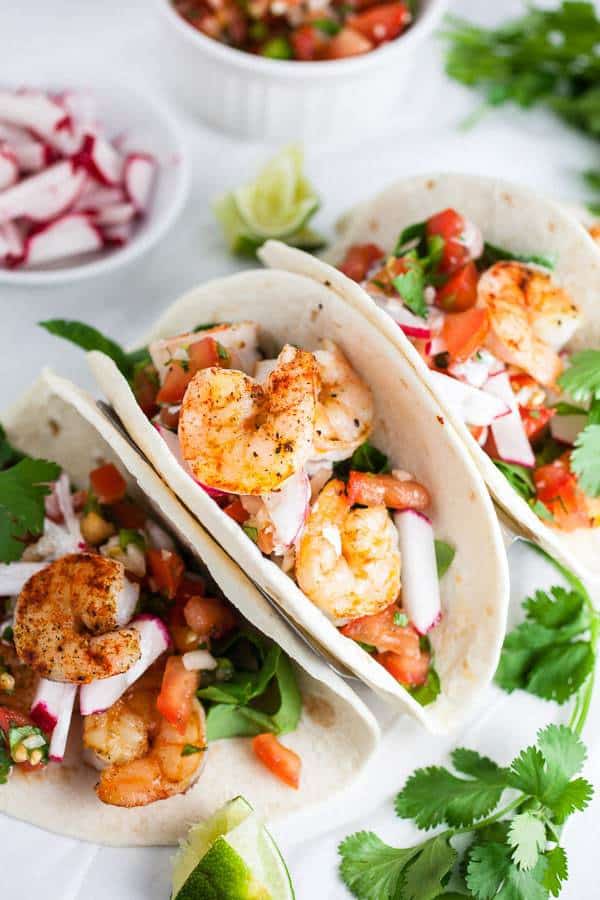 Sheet Pan Shrimp Tacos with Pico de Gallo are the perfect easy and healthy weeknight dinner! This one pan shrimp tacos recipe is ready in 20 minutes!