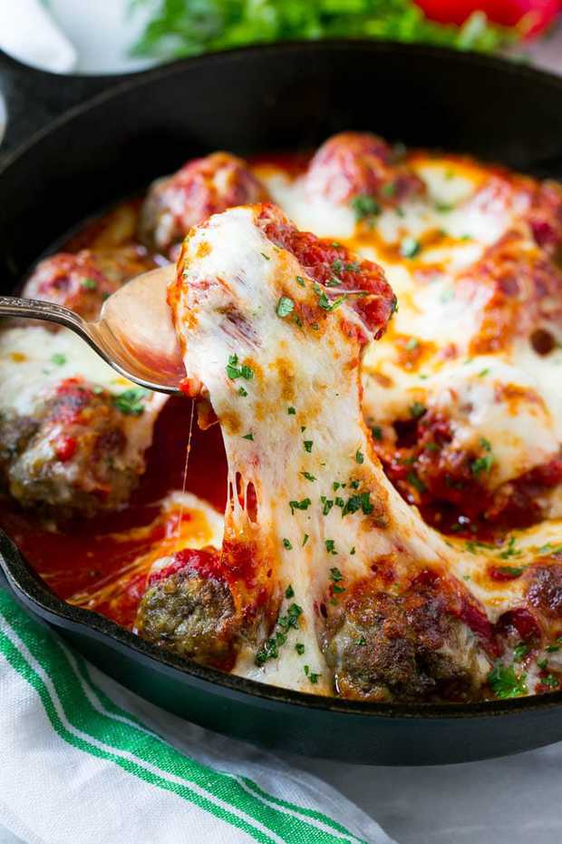 This meatball bake recipe is homemade tender meatballs smothered in tomato sauce and covered in cheese.