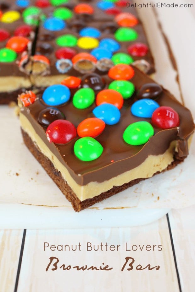 Rich, fudgy brownies are layered with peanut butter filling, a chocolate peanut butter ganache and topped with lots of M&M’s Peanut Butter candies!  The perfect treat for family game night, or anytime you’re in the mood for a chocolate and peanut butter treat!