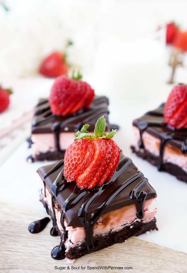 These Strawberry Layer Brownies are a sinfully sweet treat. They’re made up of a base of fudge brownies, topped with a layer of strawberry creme candy and a layer of chocolate ganache.