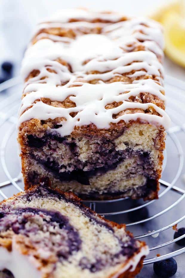 An amazingly moist muffin bread filled with blueberry pie filling.  Topped with a crumb topping and drizzled in a lemon glaze this bread is incredible!