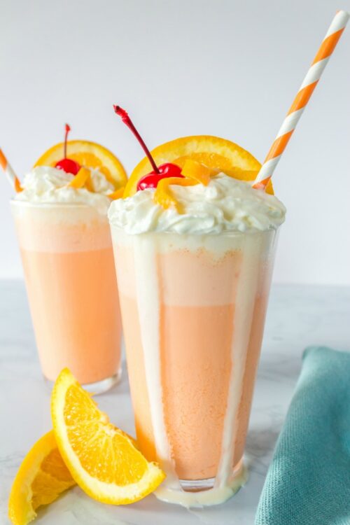 A glass of orange juice next to a cup of coffee, with Milkshake and Ice Cream