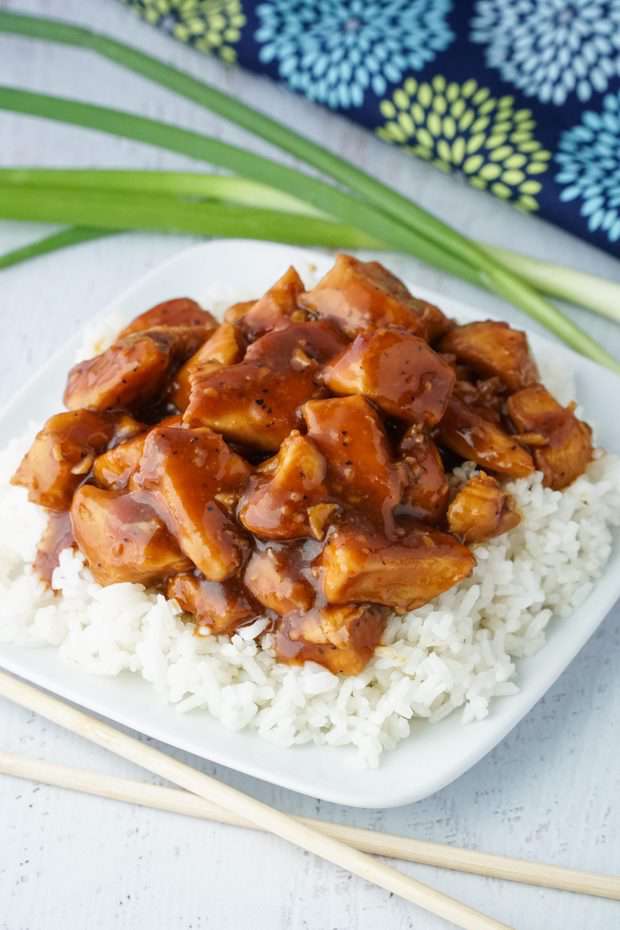 A plate of food, with Bourbon chicken