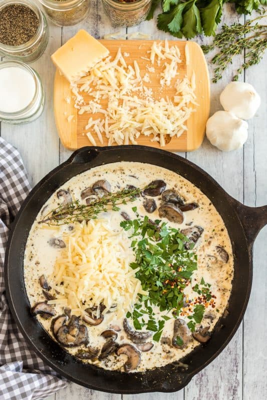 A bowl of food on a table, with Mushroom and Cream