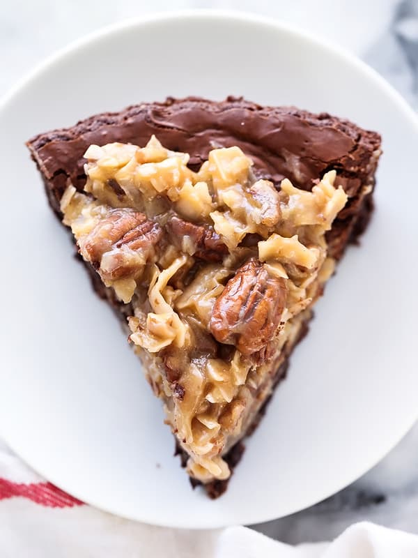 A piece of food on a plate, with Chocolate and Pecan
