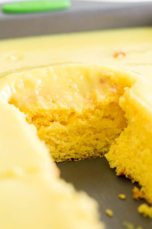 A close up of a piece of cake on a plate, with Lemon Poke Cake