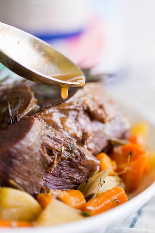 A close up of a bowl of food, with Pot roast and Beef