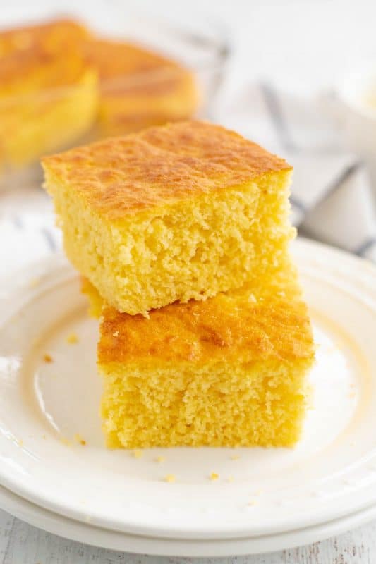 A piece of cake on a plate, with Cornbread