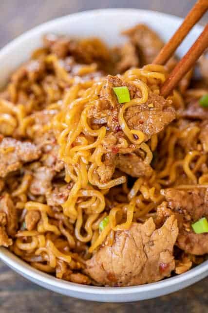 A dish is filled with food, with Noodle and Chicken