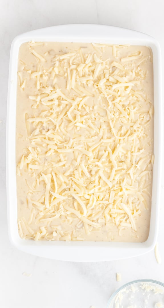 A bowl of food, with Cheese and Cream