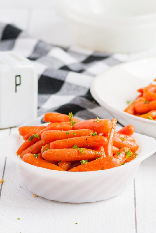 A plate of food on a table, with Glazed carrots