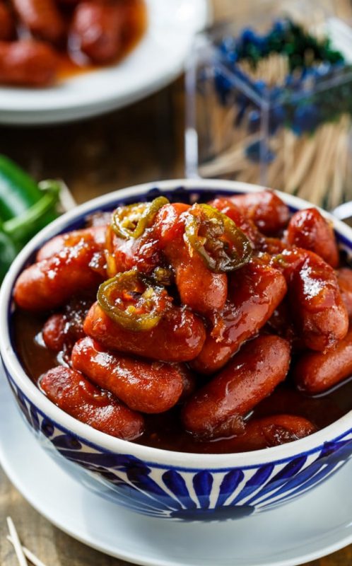 A bowl of food on a plate, with Little smokies and Slow Cooker