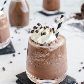 Frozen Hot Chocolate top whipped cream and chocolate chips in glass