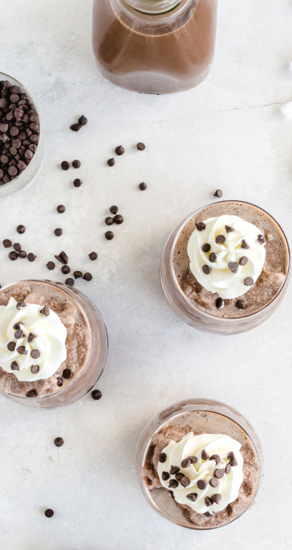 Frozen Hot Chocolate in cups topped with whipped cream and Chocolate chips
