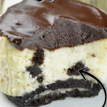 A piece of chocolate cake on a plate, with Oreo and Cookie