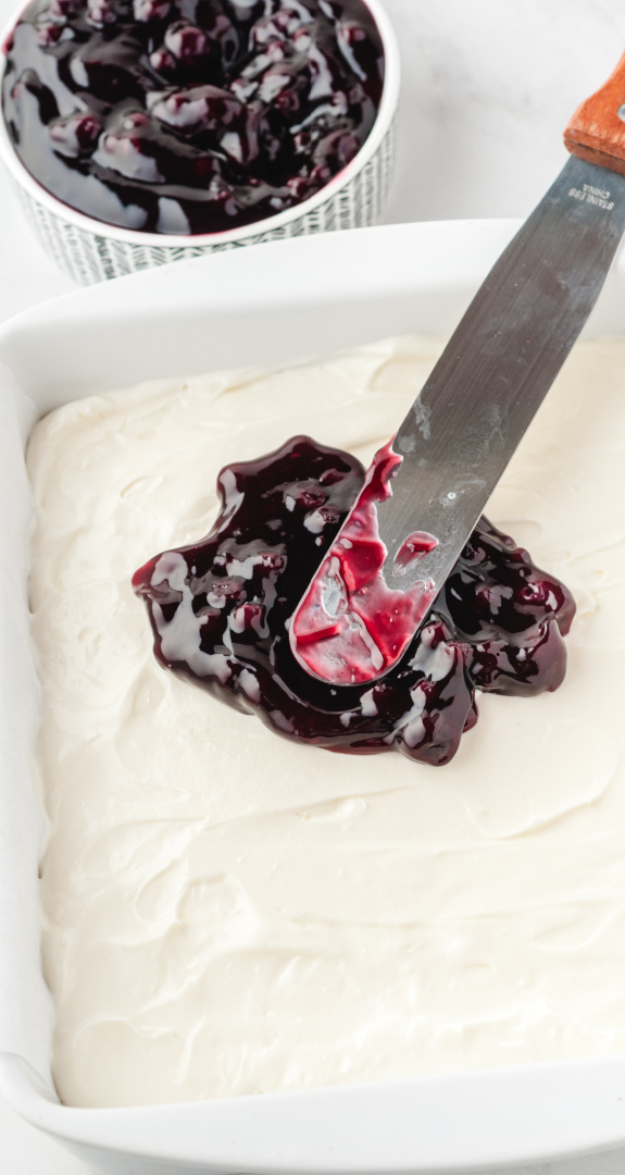spread blueberry pie filling over the cream cheese layer.