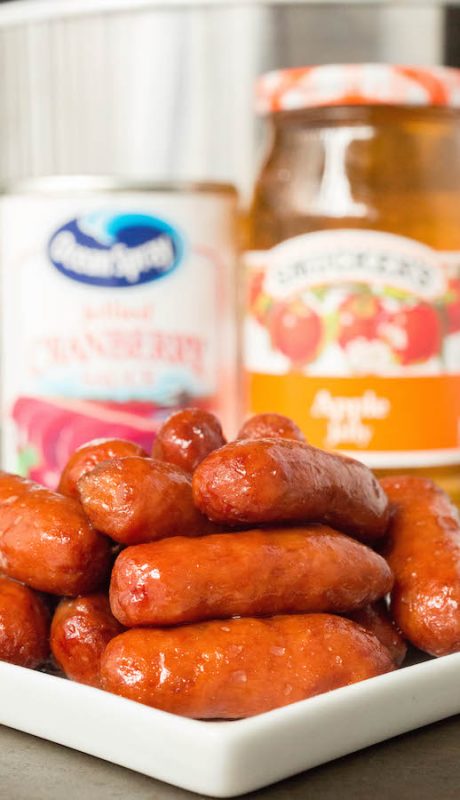 A close up of a tray of food, with Little smokies and Sausage
