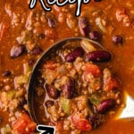 Close-up of a rich and hearty chili with ground beef, kidney beans, diced tomatoes, and green peppers, shown in a large pot with a ladle scooping out a chunky serving. Text emphasizes it as a classic comfort food chili recipe.