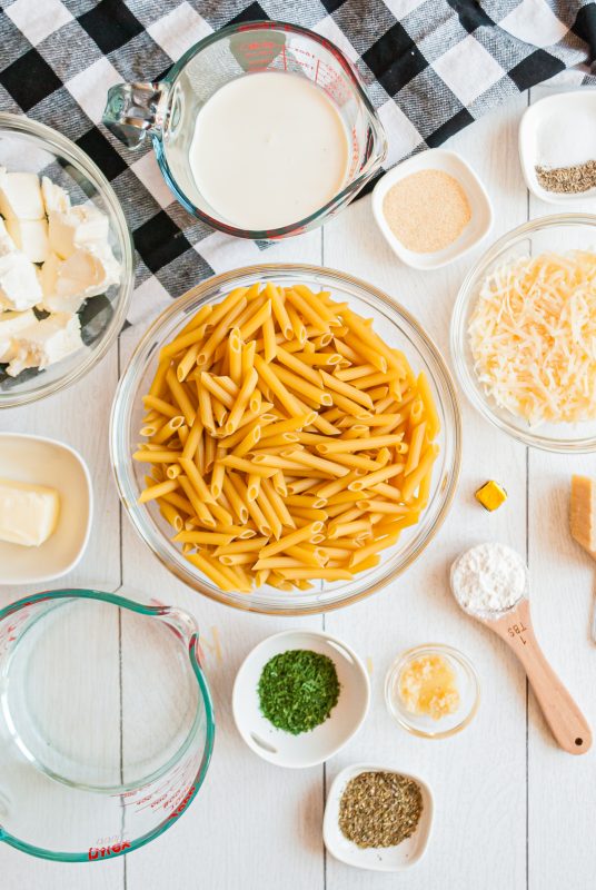 A variety of food on a table, with Pasta and side
