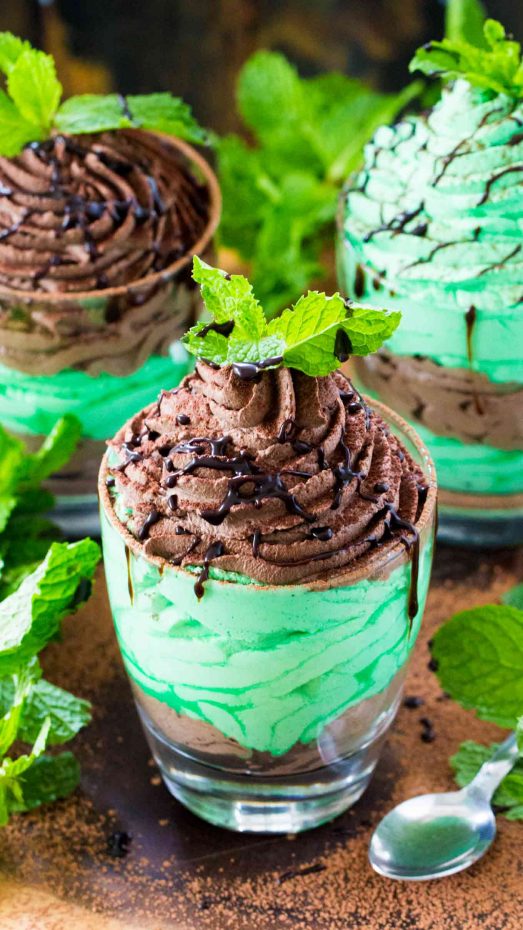 A close up of a chocolate cake sitting on top of a green plant