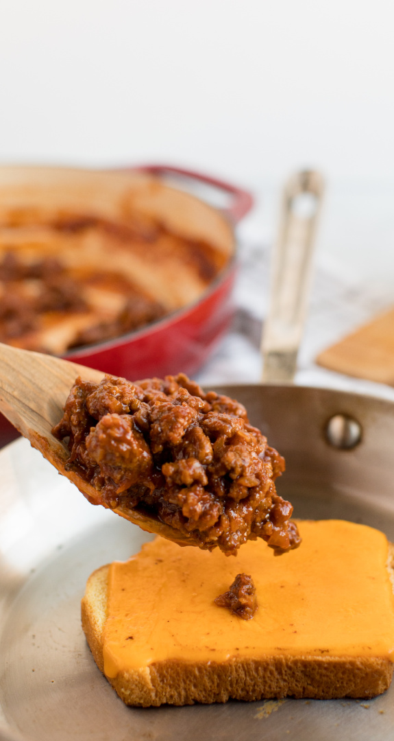 Allow the cheese to melt slightly and spoon on the sloppy joe meat