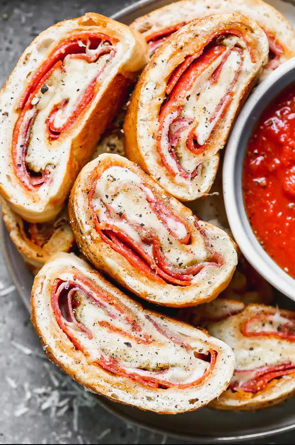 A close up of food, with Stromboli and Cheese
