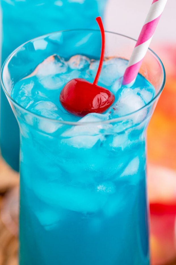 A glass with a blue cup, with Vodka and Blue Hawaii