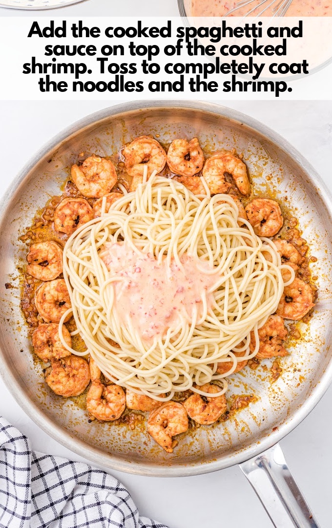 A plate of food on a table, with Shrimp pasta
