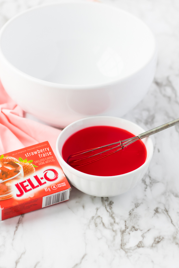 mixed strawberry jello in small bowl