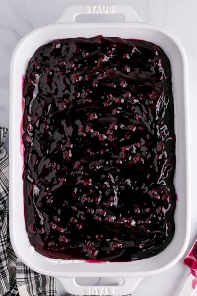 blueberry pie filling spread over the cream cheese layer