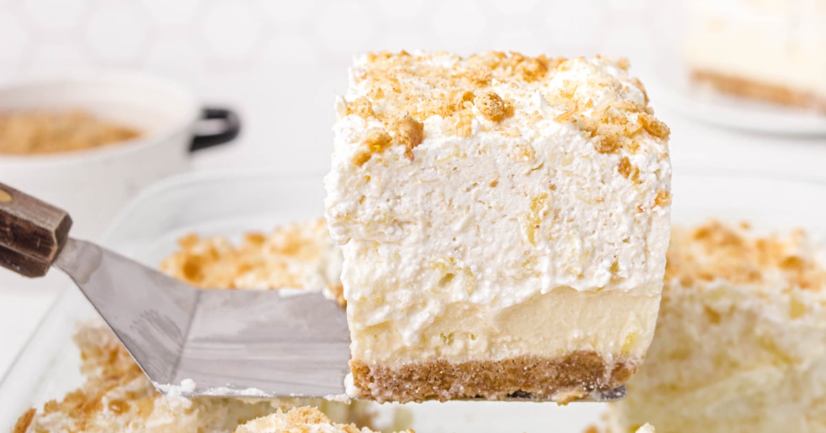 A piece of Pineapple Delight on a cake lifter.