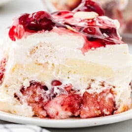 A slice of heaven on earth cake on a white dessert plate.