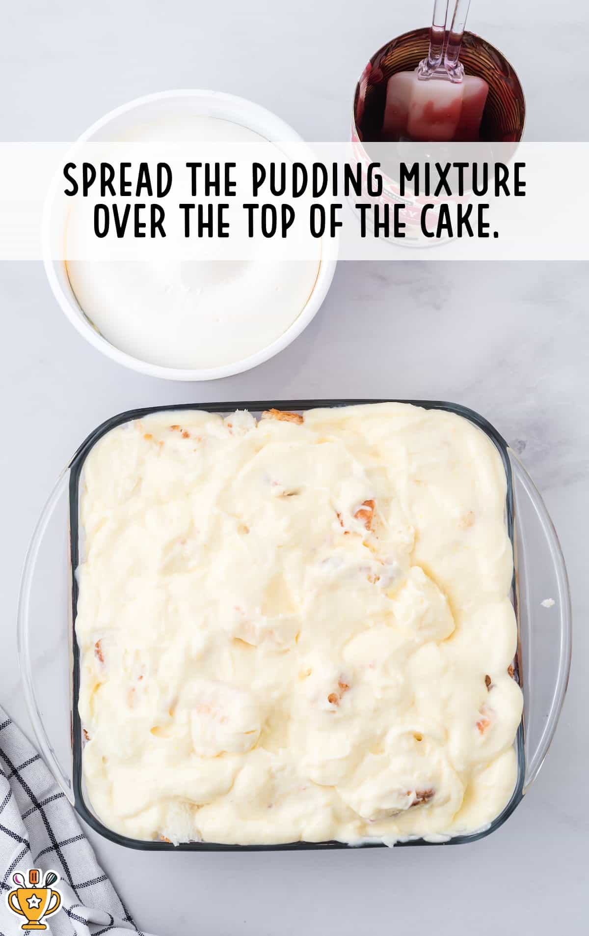 The cake is topped with the cool whip mixture.