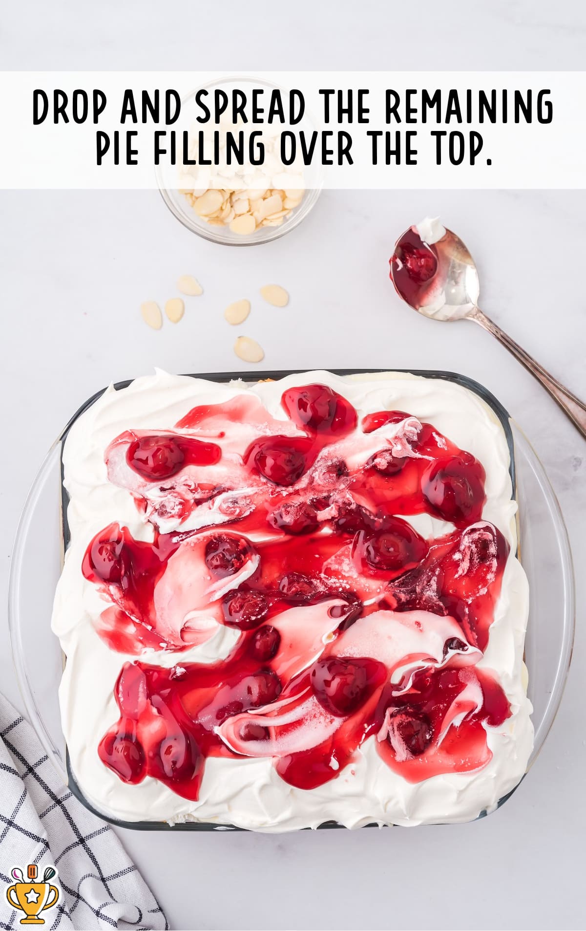 The heaven on earth cake is topped with a pie filling garnish.