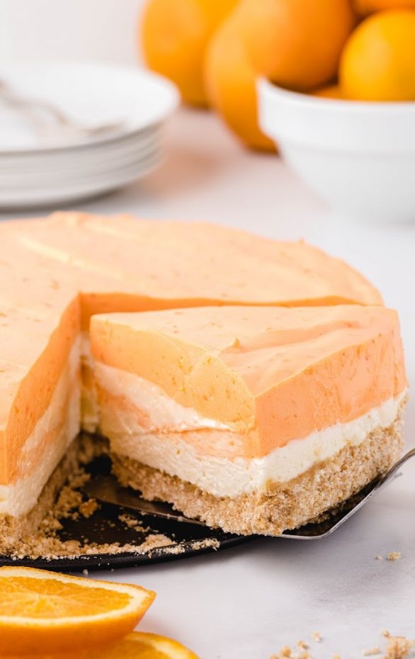 A slice of cake on a plate, with Cream and Orange