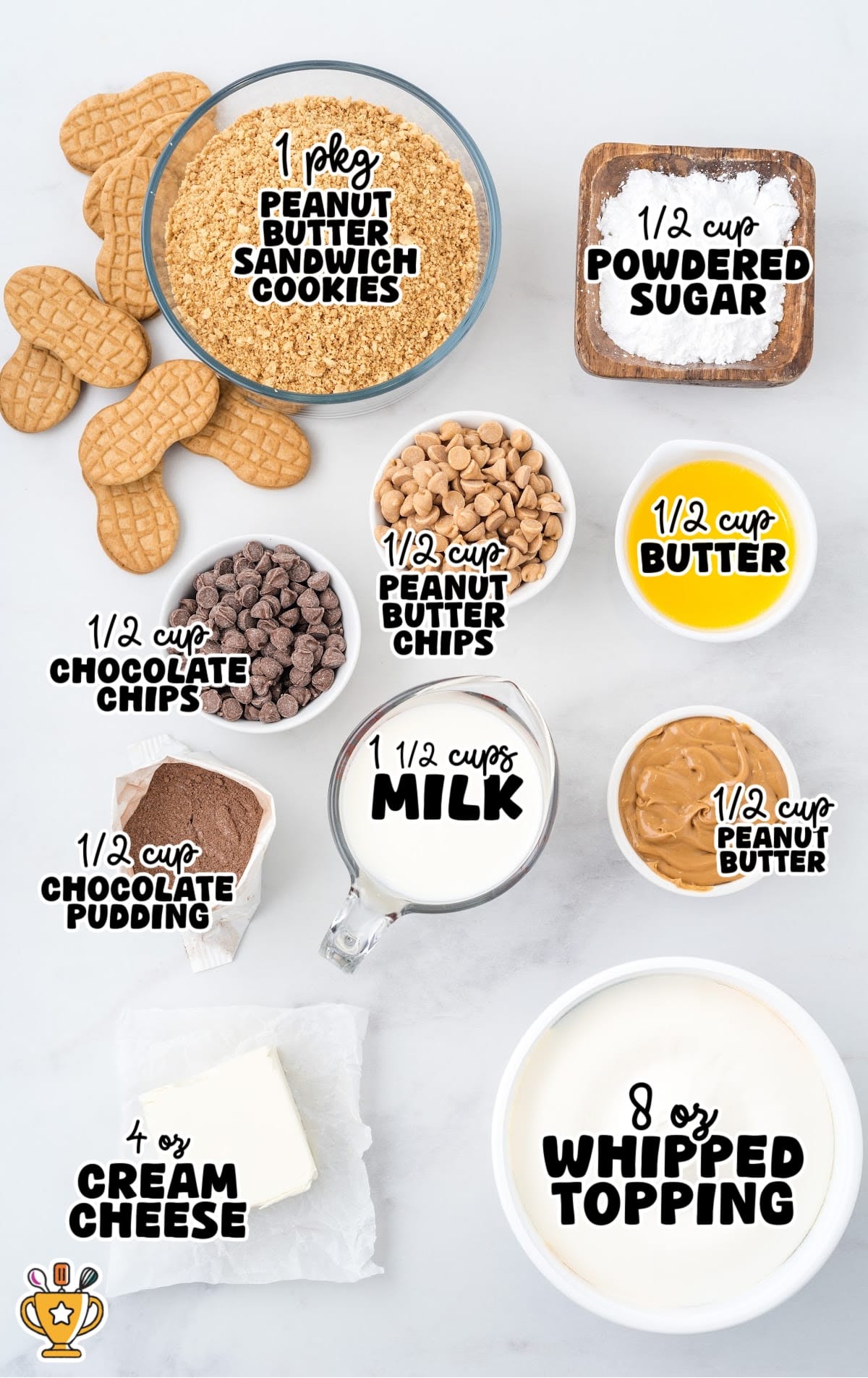 Flat lay of peanut butter dream bars ingredients on a white surface, including peanut butter cookies, butter, milk, chocolate pudding, cream cheese, powdered sugar, peanut butter, whipped topping, chocolate chips, and peanut butter chips.