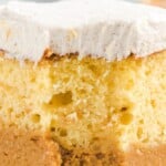 Pumpkin magic cake with layers of moist yellow cake, creamy pumpkin pie filling, and fluffy spiced whipped topping.