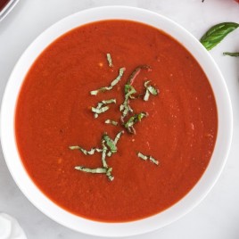 A bowl of soup, with Tomato