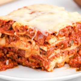 A close up of a plate of food, with Lasagna
