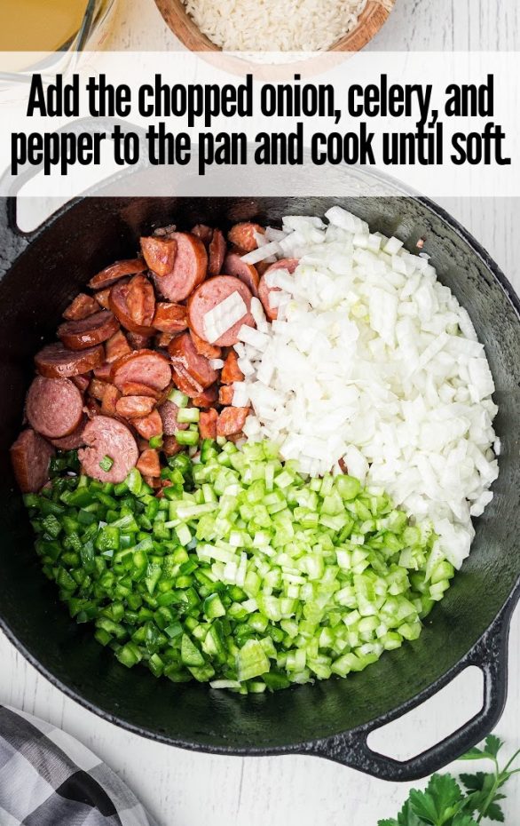 A plate of food with rice and broccoli, with Sausage and Red beans and rice