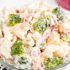 A close up of a plate of food with broccoli, with Cauliflower and Salad