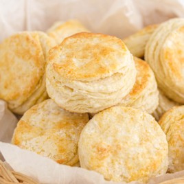 A basket filled with food, with Biscuit and Butter