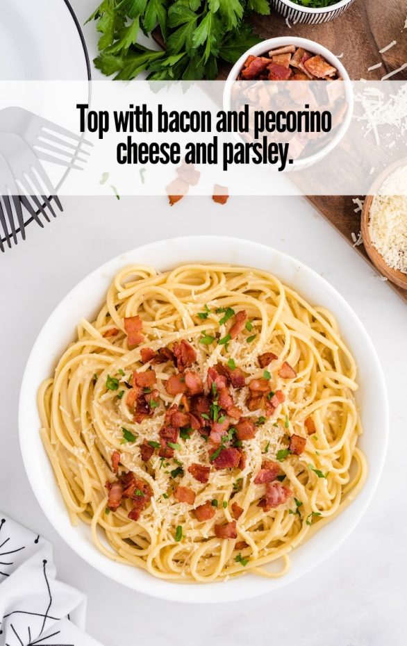 A bowl of pasta sits on a plate, with Carbonara and Linguine