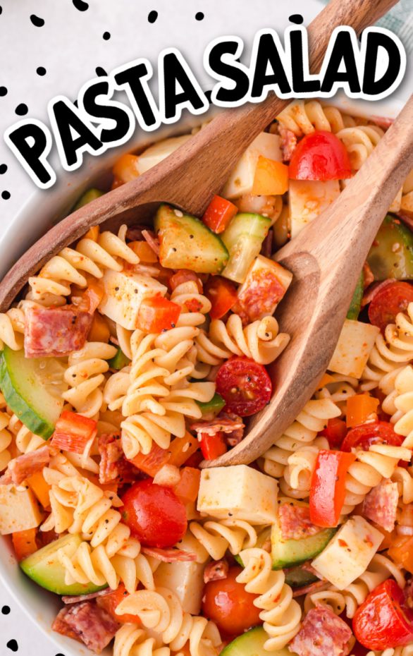 A box filled with different types of food on a plate, with Pasta and Salad