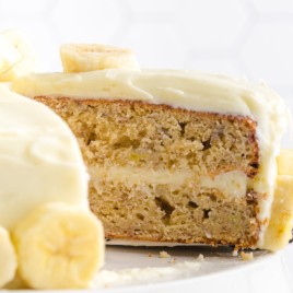 A piece of cake on a plate, with Banana