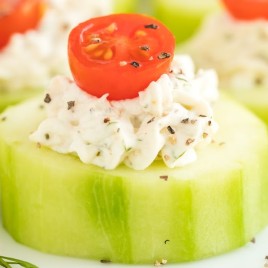 A close up of food on a plate, with Cucumber