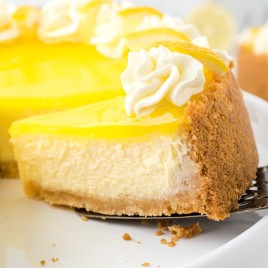A slice of cake on a plate, with Cheesecake and Lemon