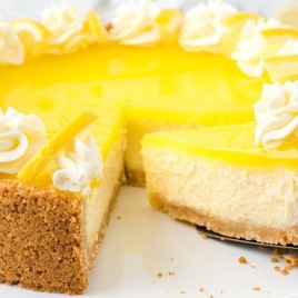 A piece of cake on a plate, with Cheesecake and Lemon