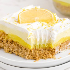 A piece of cake on a plate, with Lemon